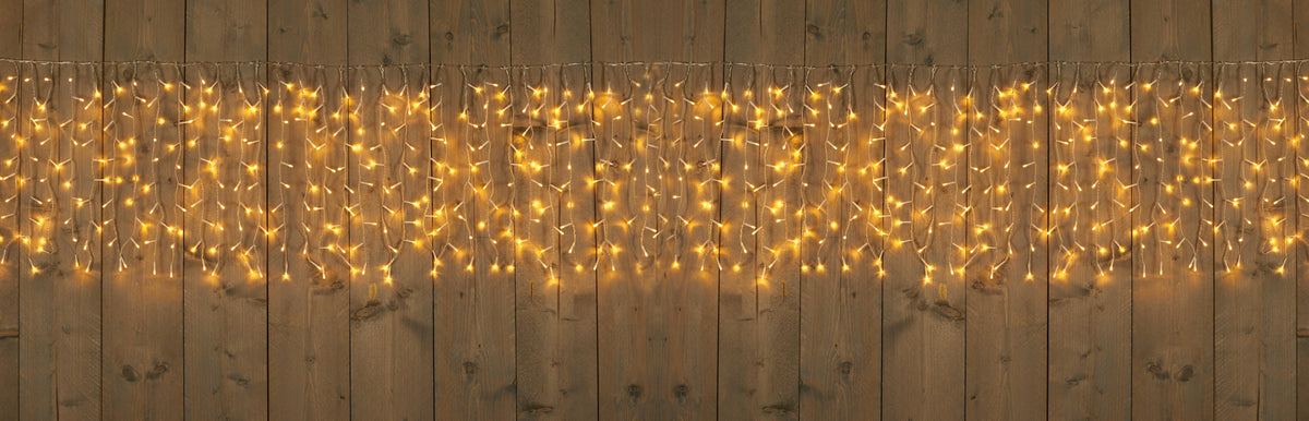 gordijnverlichting outdoor 100 strengen 1000l/500x50cm led warm wit - 5m aanloopsnoer transparant - ip44 trafo aan / 8/16u timer / uit