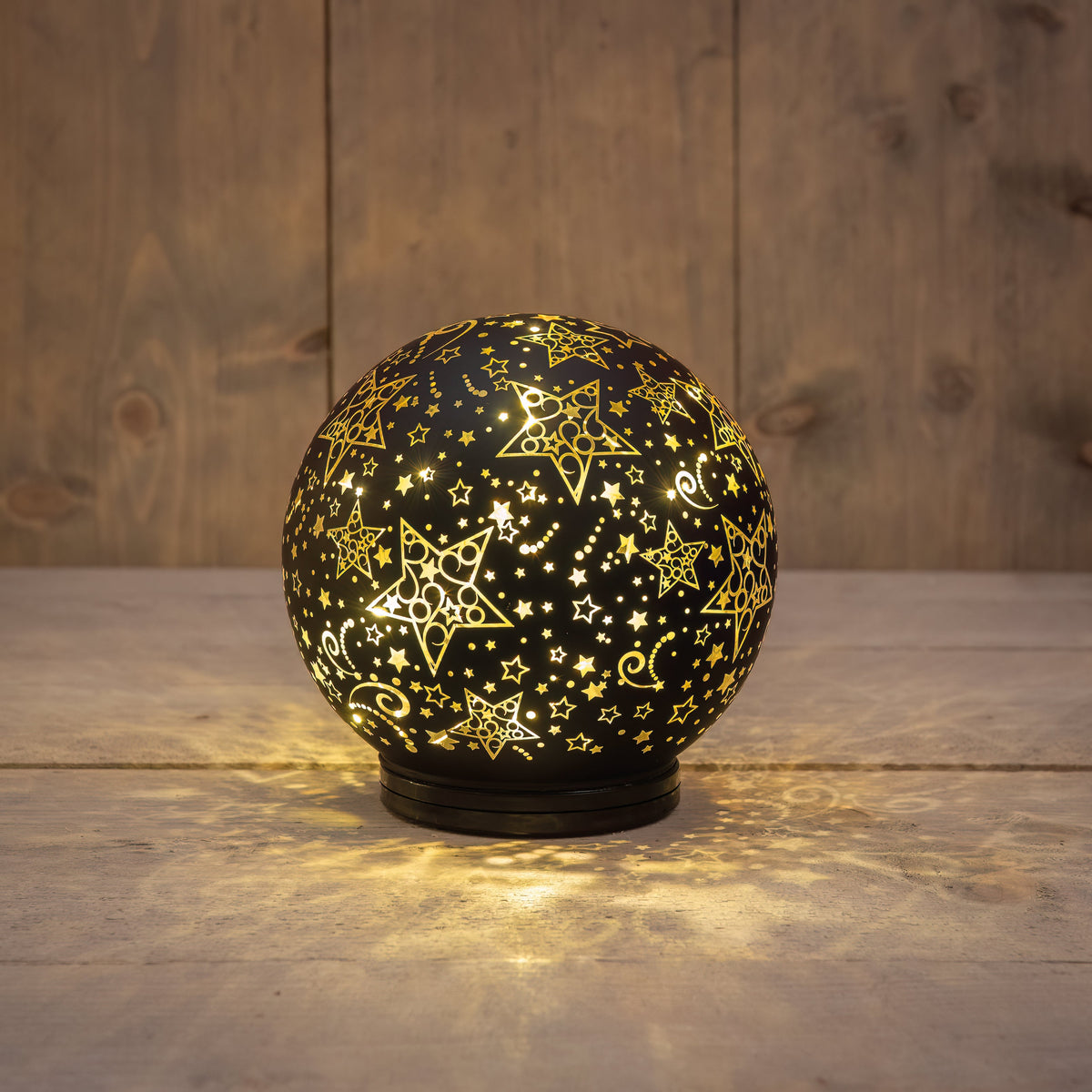 bal glas op voet draaiend led op batterij 15cm zwart/goud sterren
